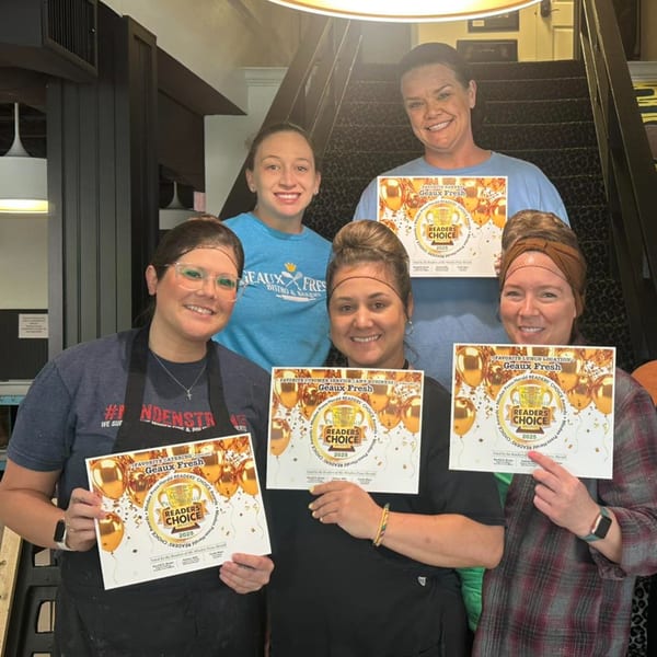 Five smiling Geaux Fresh staff members proudly display their "Readers' Choice 2025" awards.